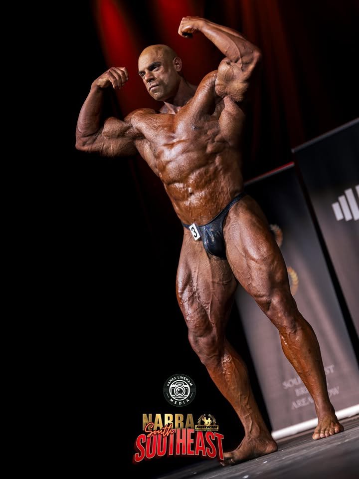 NABBA Pro Jim Georgiou front double bicep